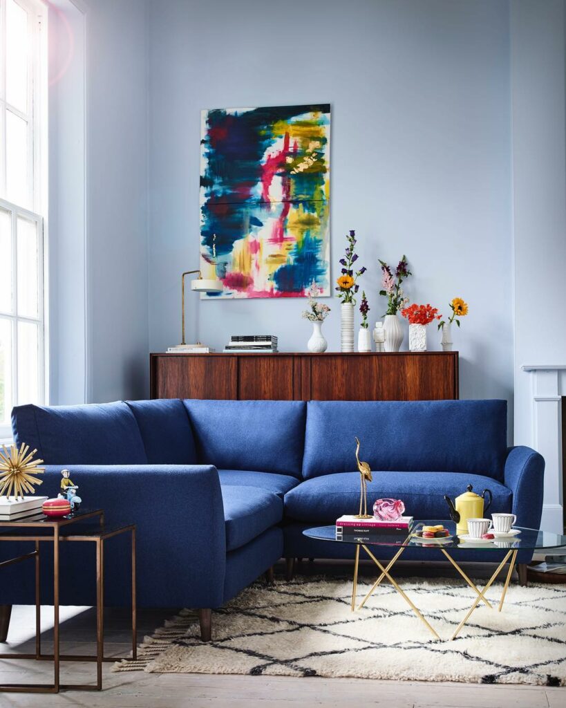 living room with blue sofa