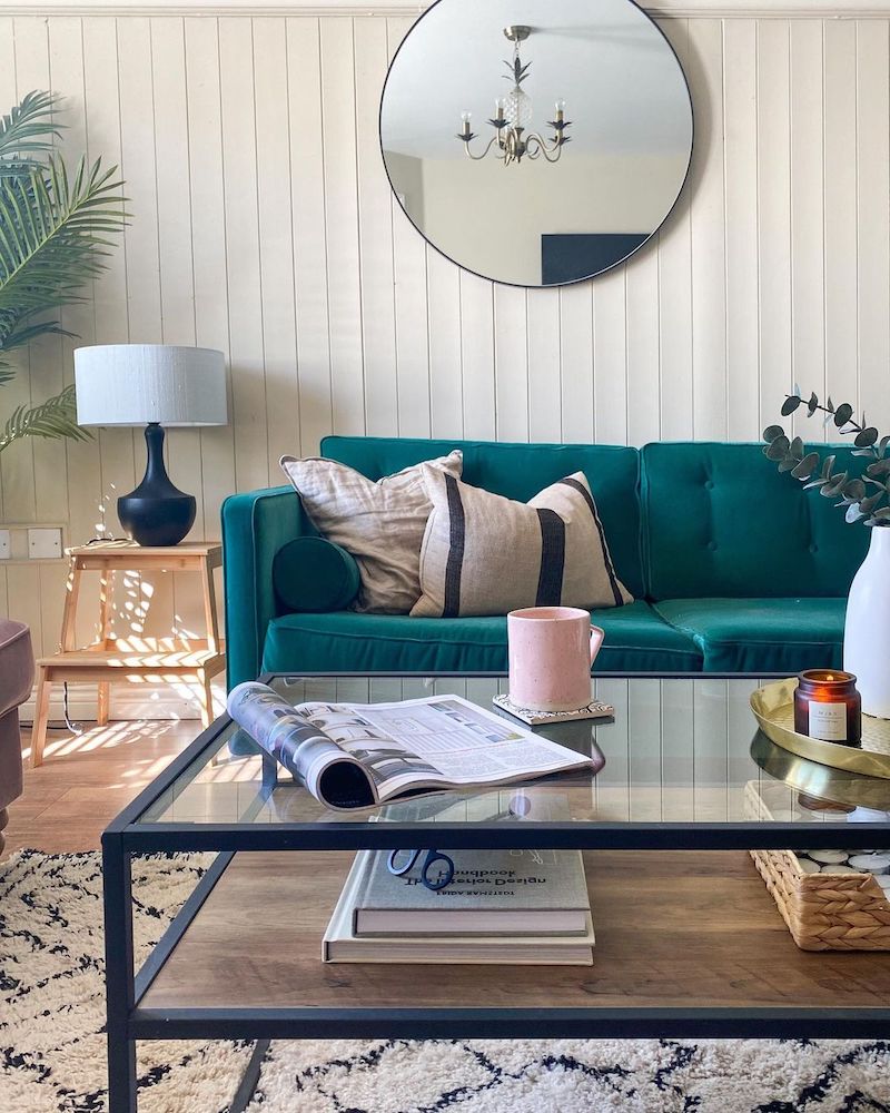living room with dark green sofa