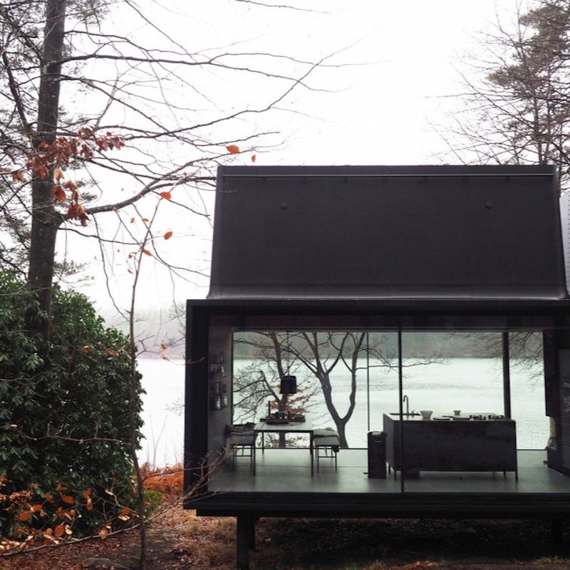 modern black houses in the woods